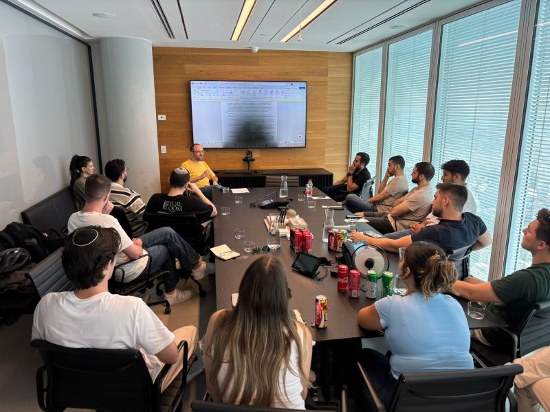 A small-room BIU.VC session around a boardroom table